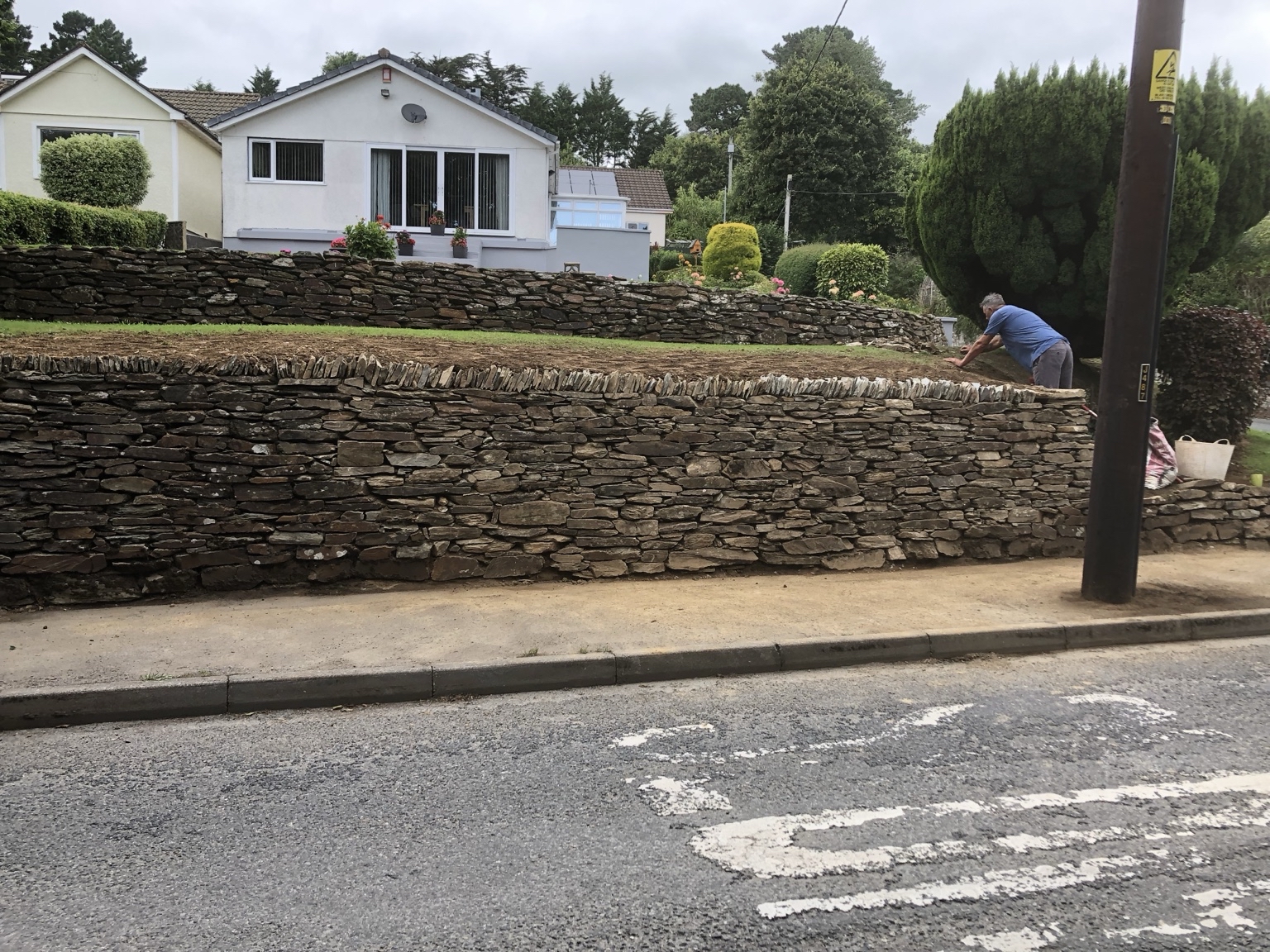 Roadside Cornish hedge and stone retaining wall built in South East Cornwall