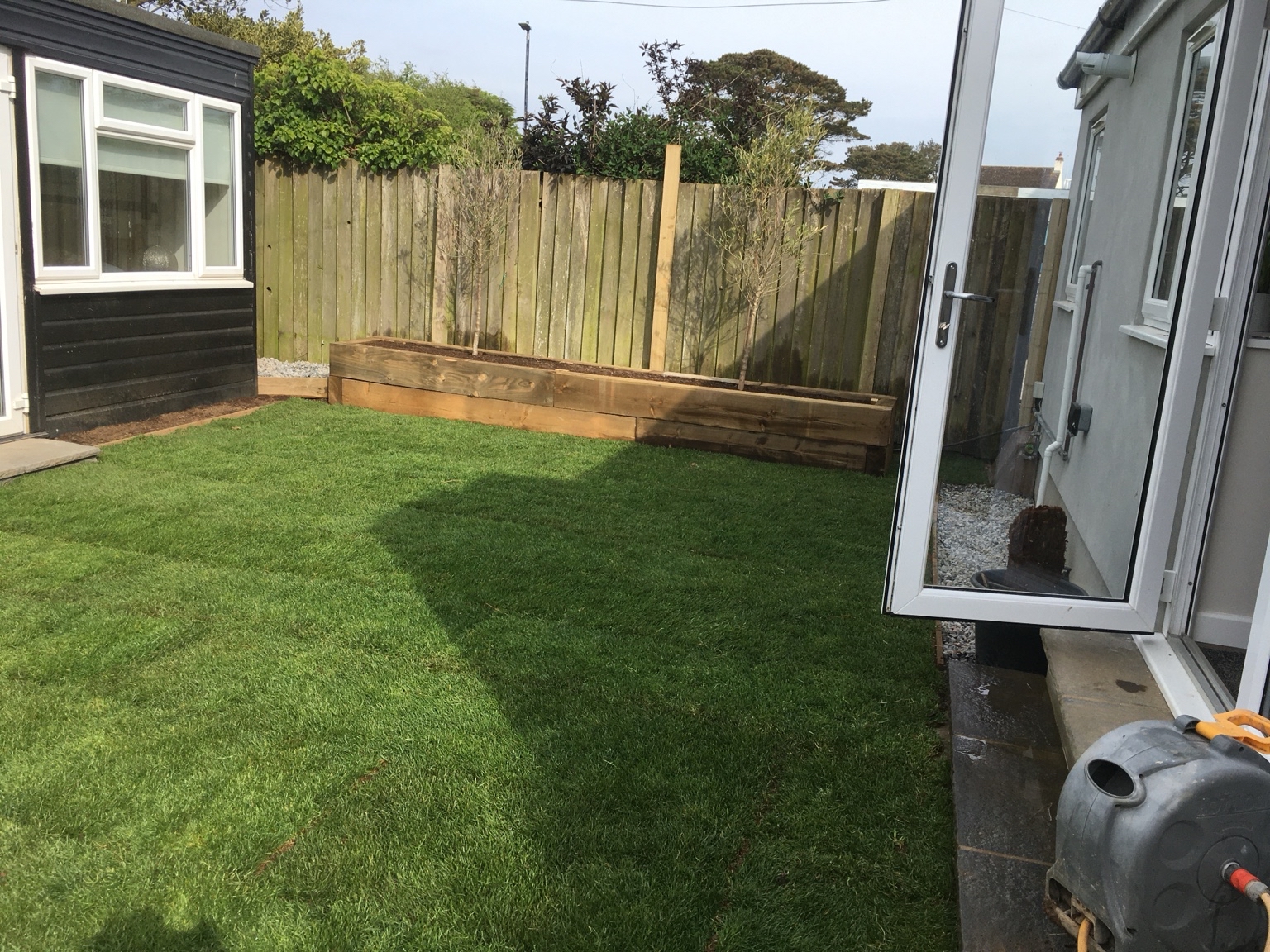 Finished newly turfed lawn after lawn cutting and turfing work in South East Cornwall